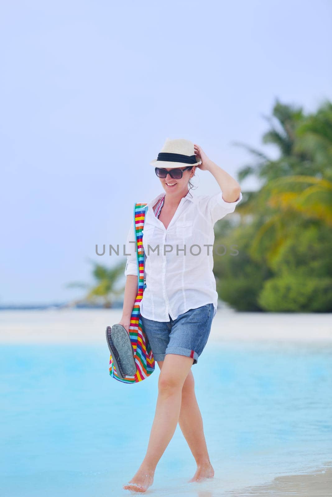 beautifel and happy woman girl on beach have fun and relax on summer vacation  over the beautiful tropical sea