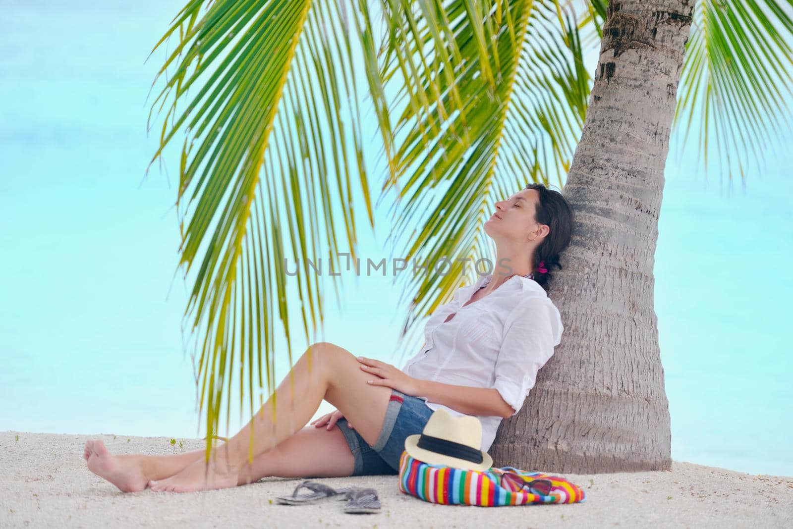 beautifel and happy woman girl on beach have fun and relax on summer vacation  over the beautiful tropical sea