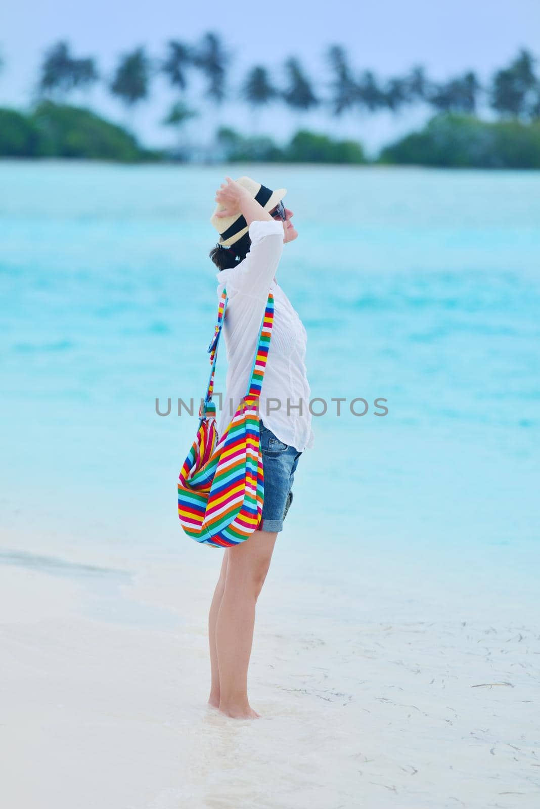 beautifel and happy woman girl on beach have fun and relax on summer vacation  over the beautiful tropical sea