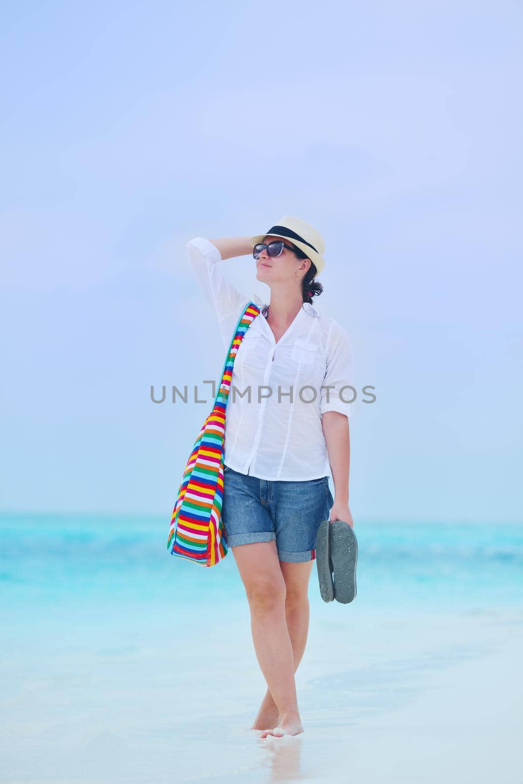 beautifel and happy woman girl on beach have fun and relax on summer vacation  over the beautiful tropical sea