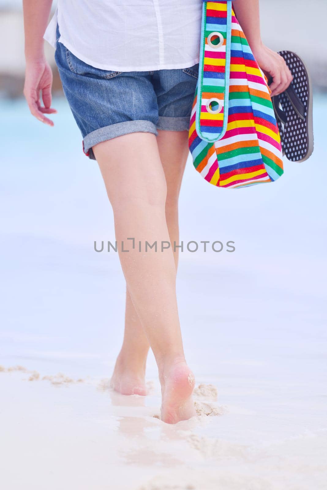 beautiful and happy woman girl on beach have fun and relax on summer vacation  over the sea