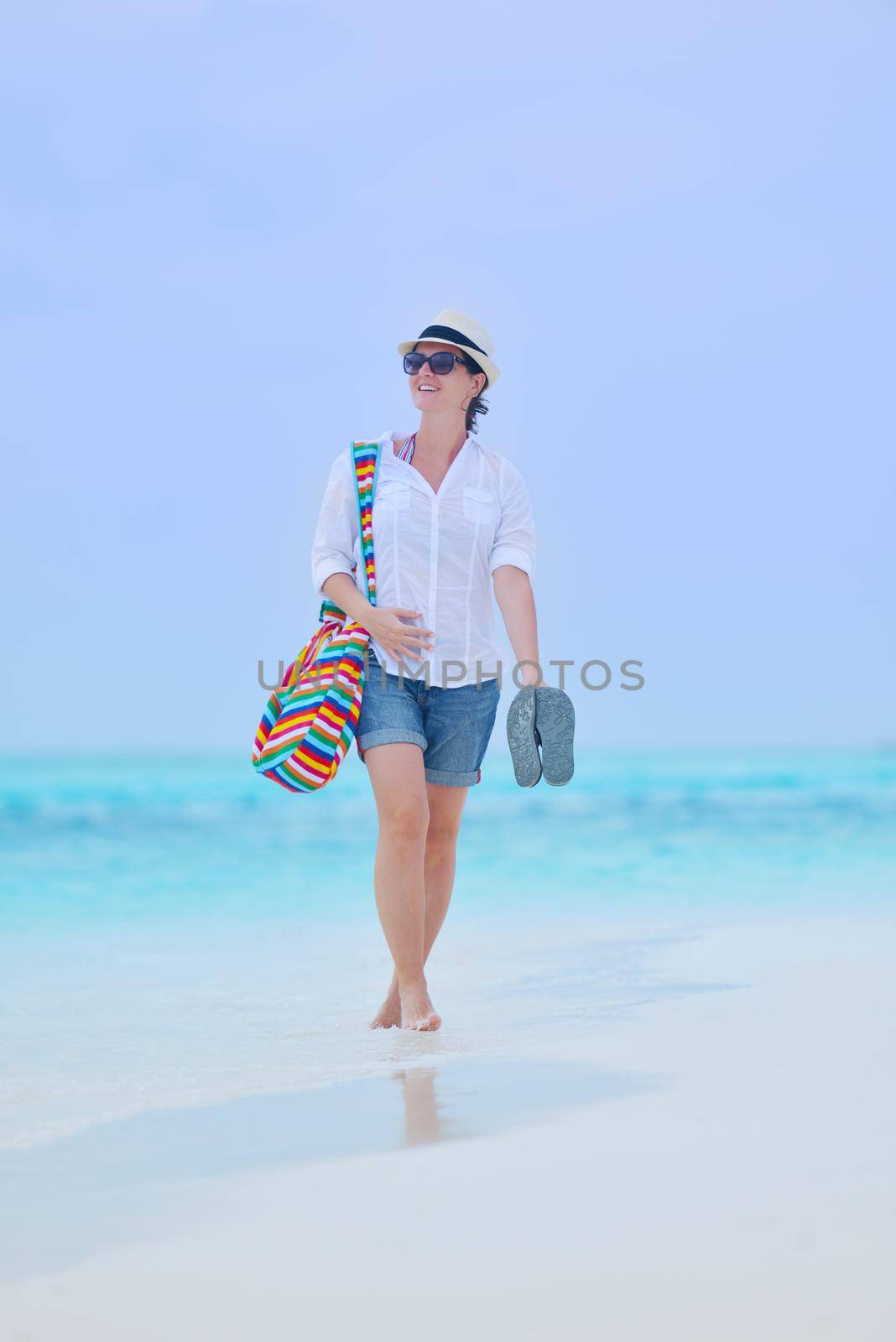 beautifel and happy woman girl on beach have fun and relax on summer vacation  over the beautiful tropical sea