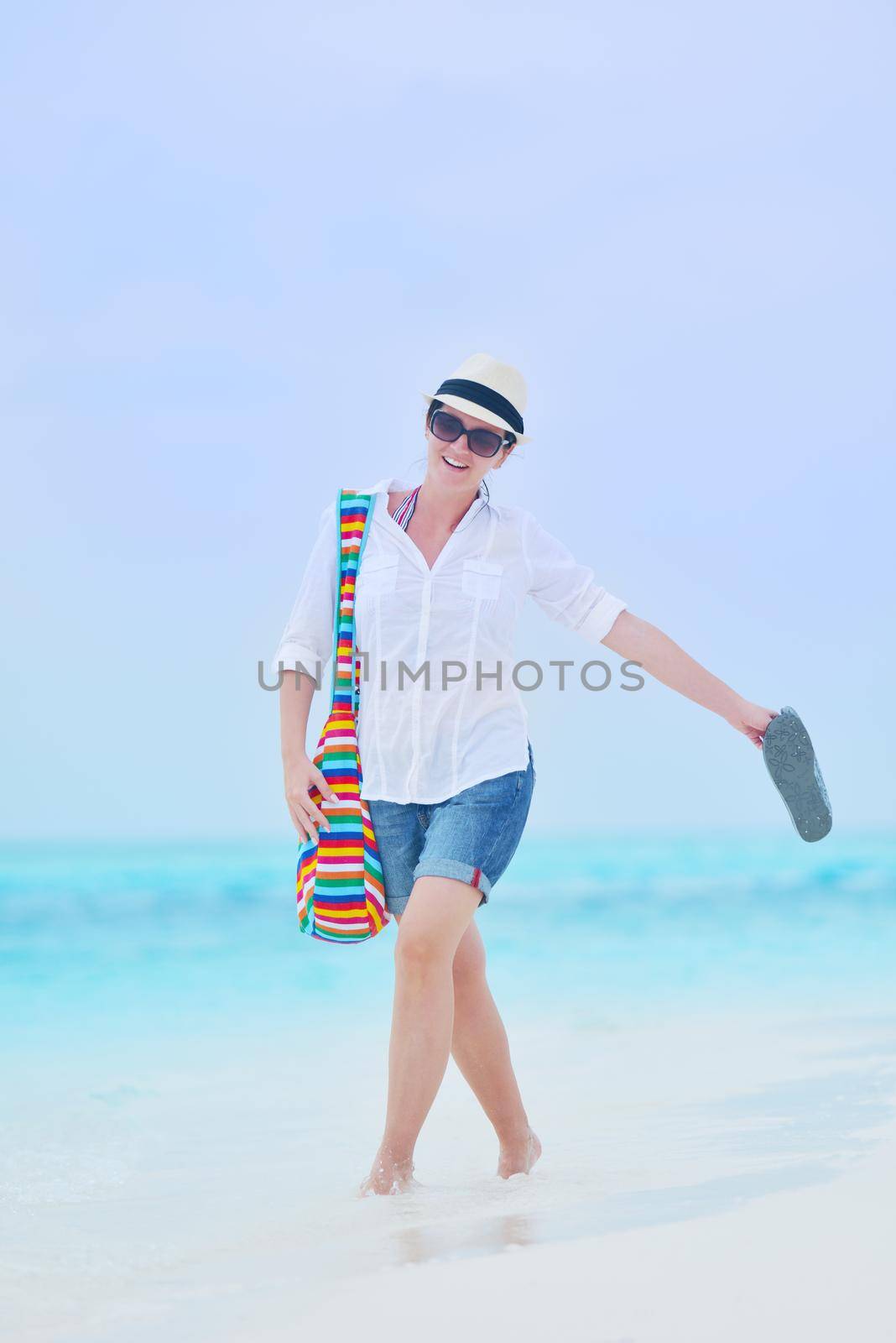 beautifel and happy woman girl on beach have fun and relax on summer vacation  over the beautiful tropical sea