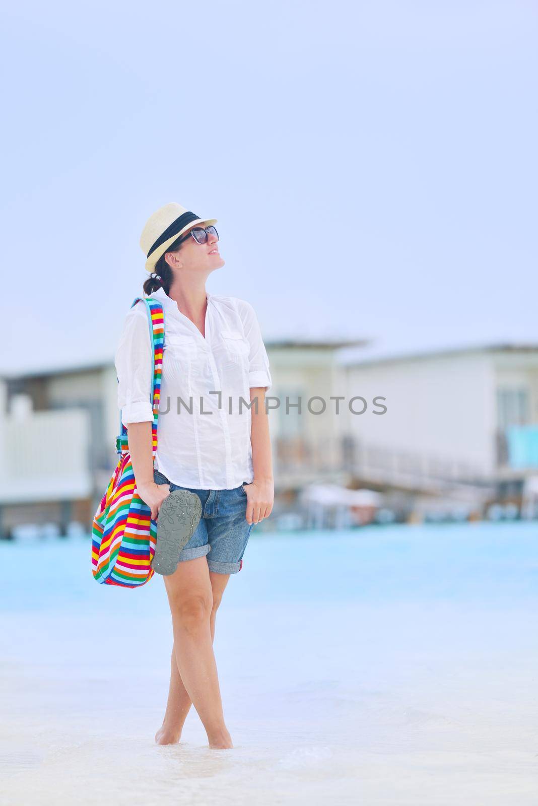 beautifel and happy woman girl on beach have fun and relax on summer vacation  over the beautiful tropical sea