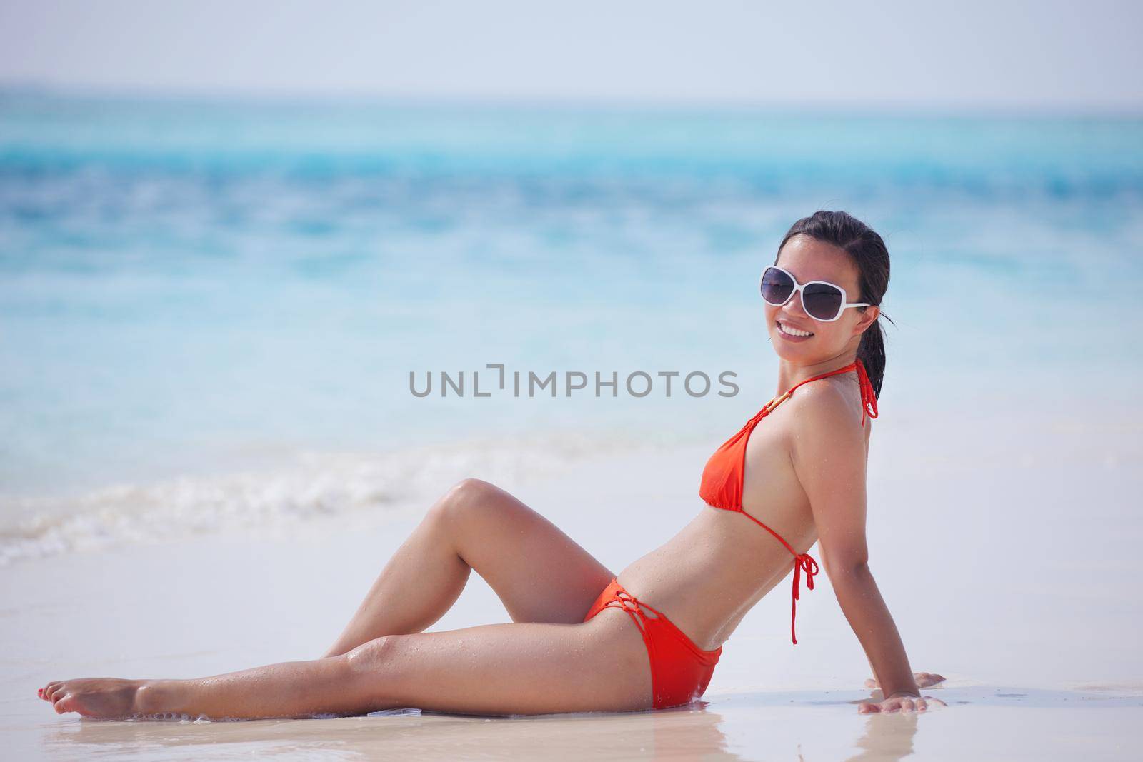 beautiful girl on beach have fun and relax by dotshock