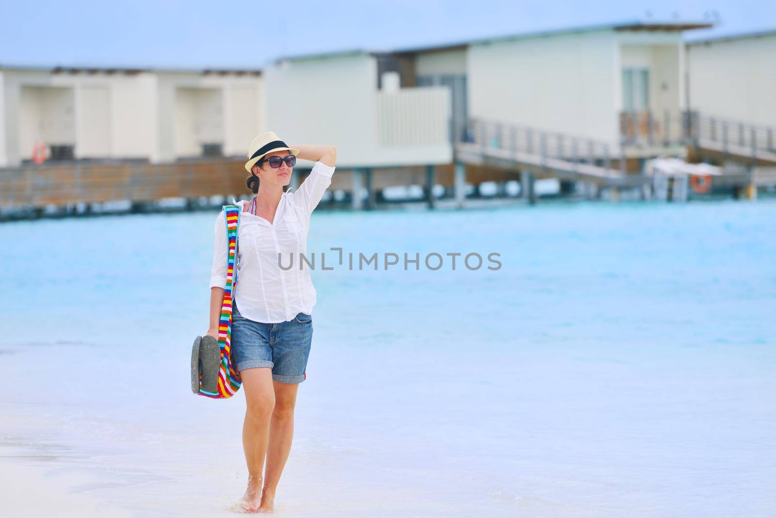 beautifel and happy woman girl on beach have fun and relax on summer vacation  over the beautiful tropical sea