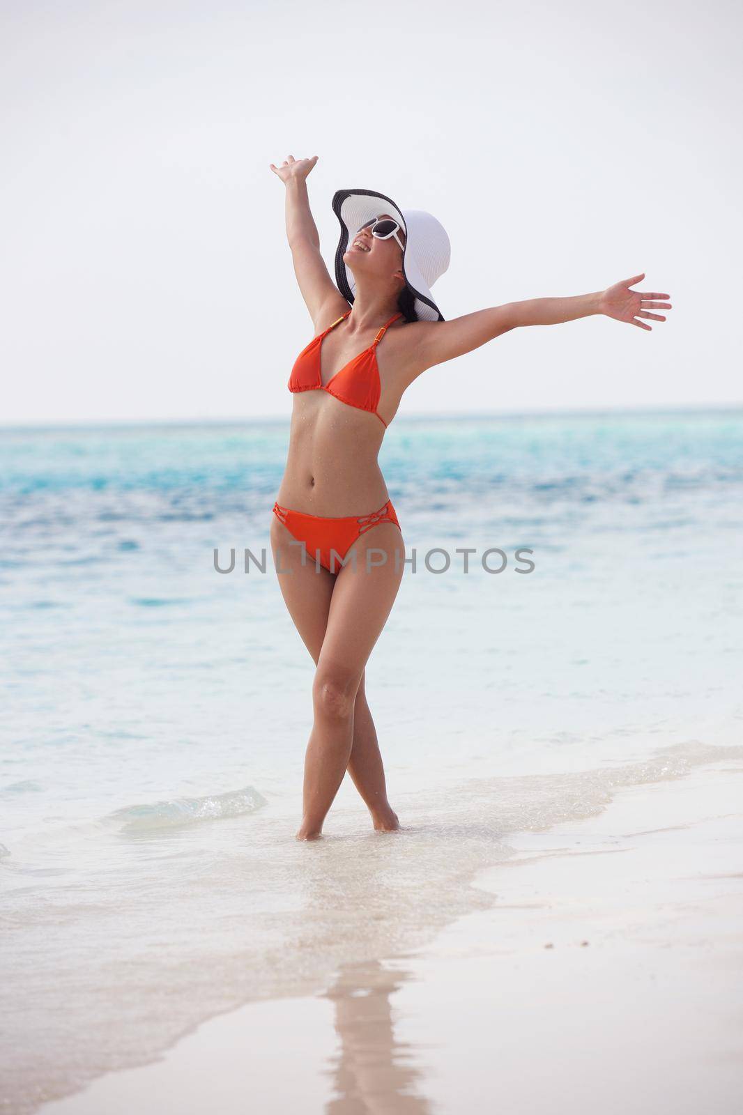 beautifel and happy woman girl on beach have fun and relax on summer vacation  over the sea