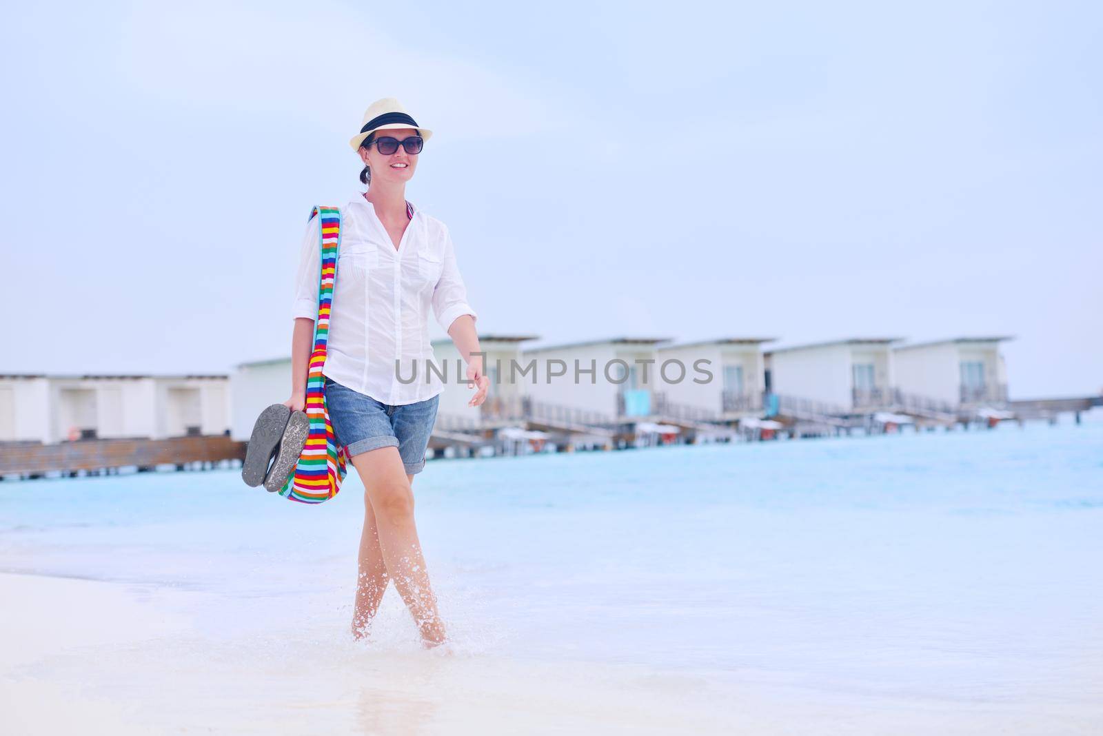 beautiful and happy woman girl on beach have fun and relax on summer vacation  over the sea