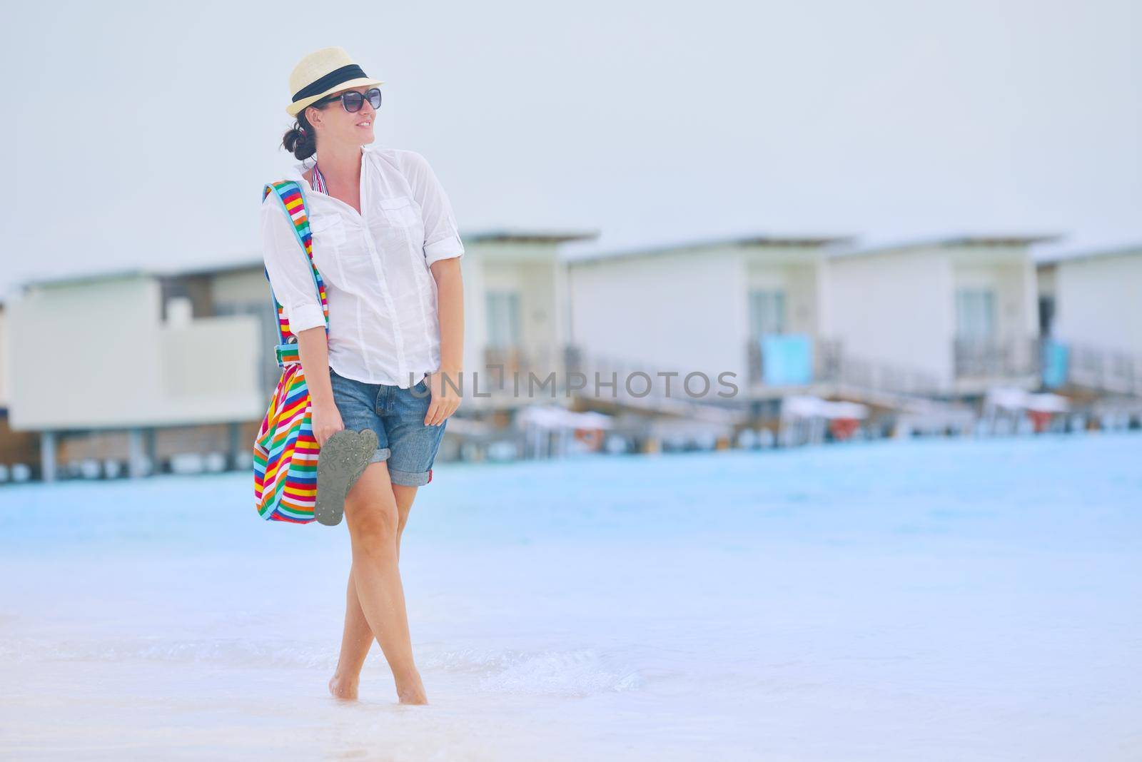 beautifel and happy woman girl on beach have fun and relax on summer vacation  over the beautiful tropical sea