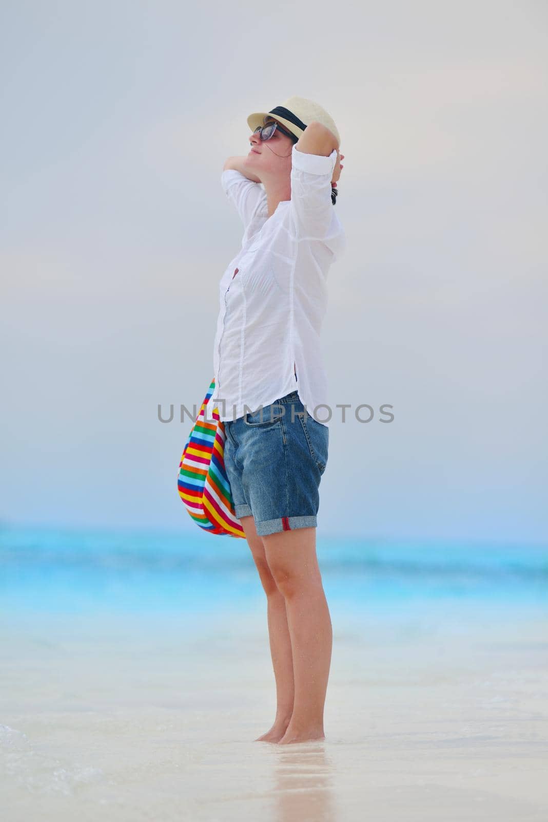 beautifel and happy woman girl on beach have fun and relax on summer vacation  over the beautiful tropical sea