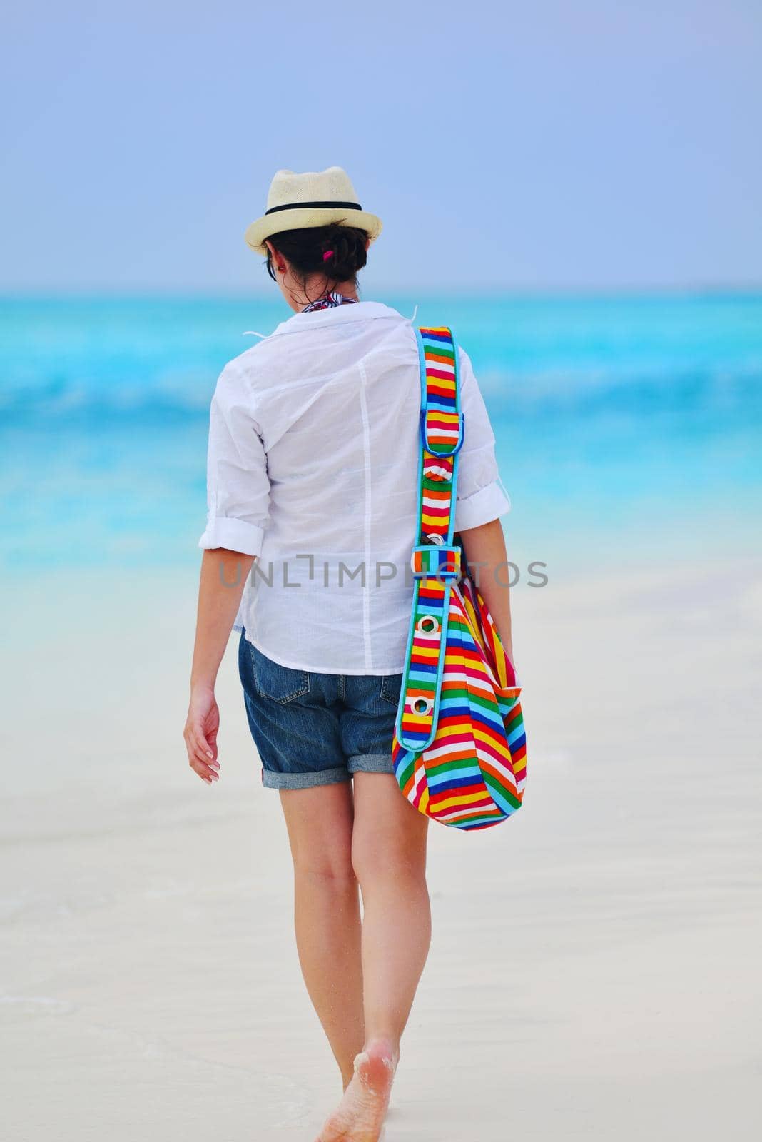 beautifel and happy woman girl on beach have fun and relax on summer vacation  over the beautiful tropical sea