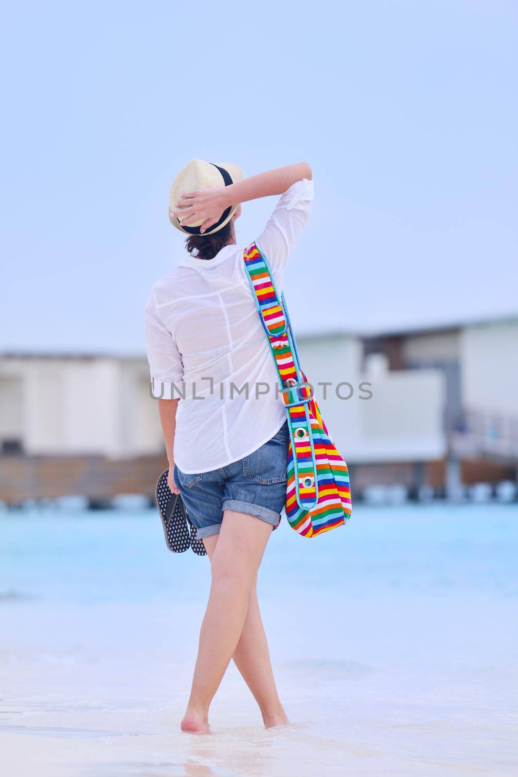 beautiful and happy woman girl on beach have fun and relax on summer vacation  over the sea
