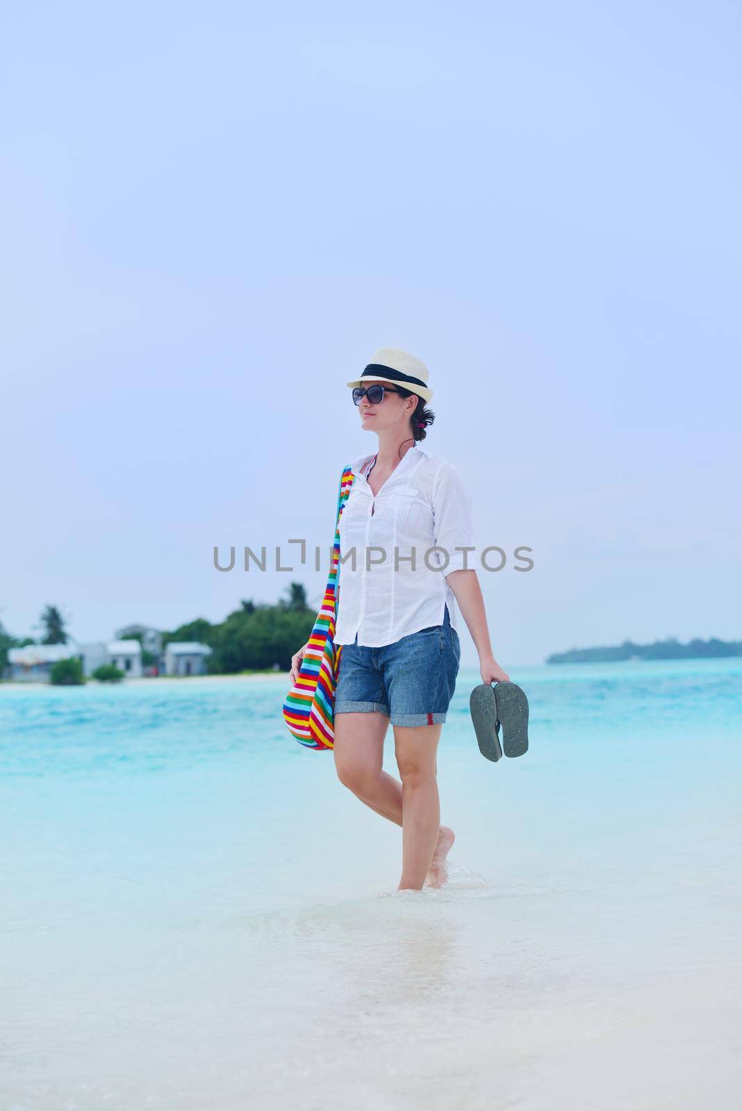 beautifel and happy woman girl on beach have fun and relax on summer vacation  over the beautiful tropical sea