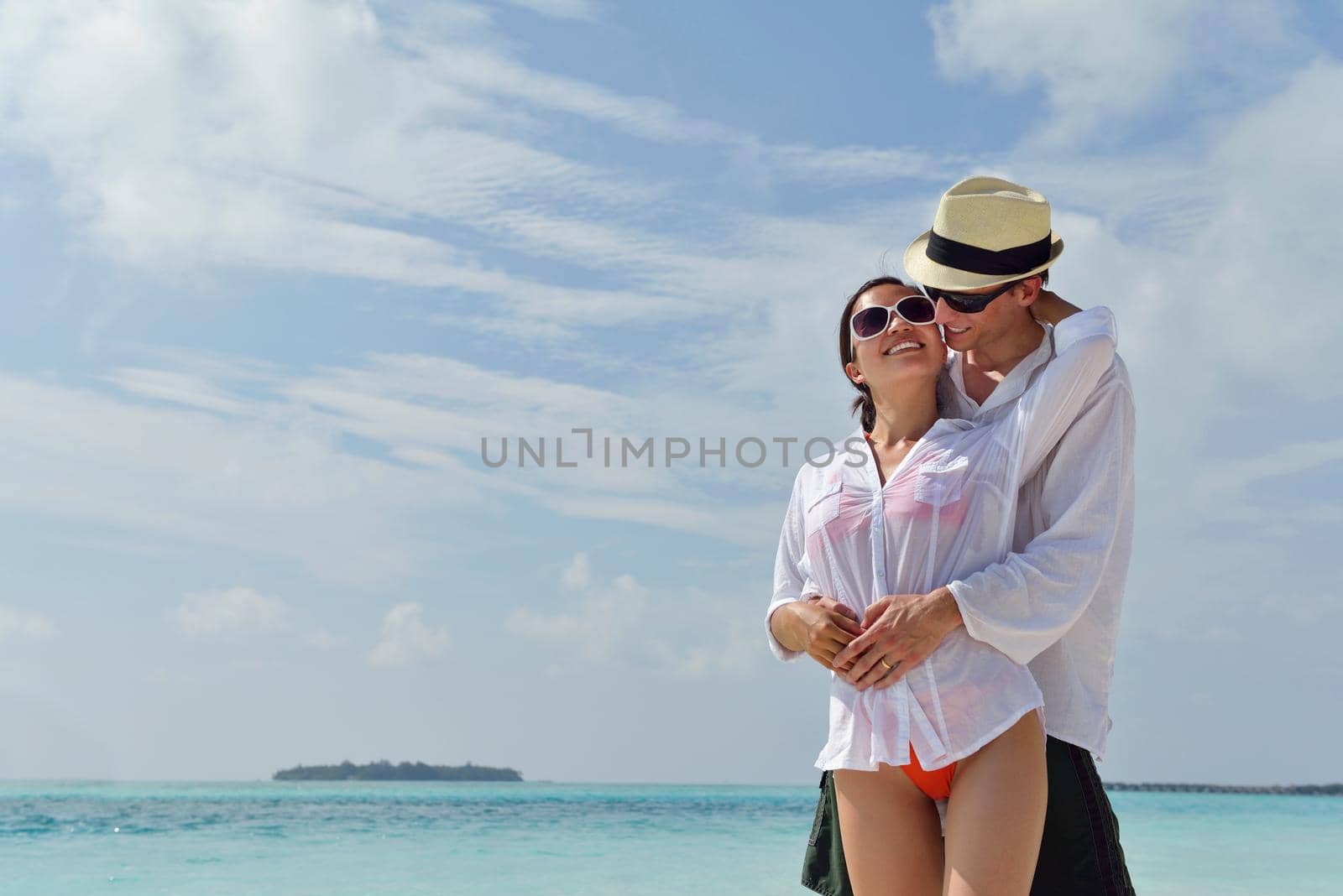 happy young romantic couple in love have fun running and relaxing on beautiful beach