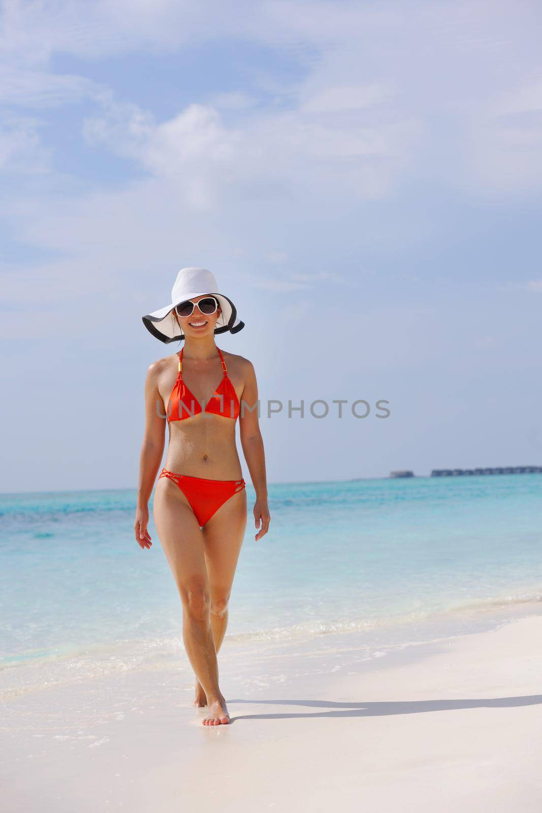 beautiful and happy woman girl on beach have fun and relax on summer vacation  over the sea