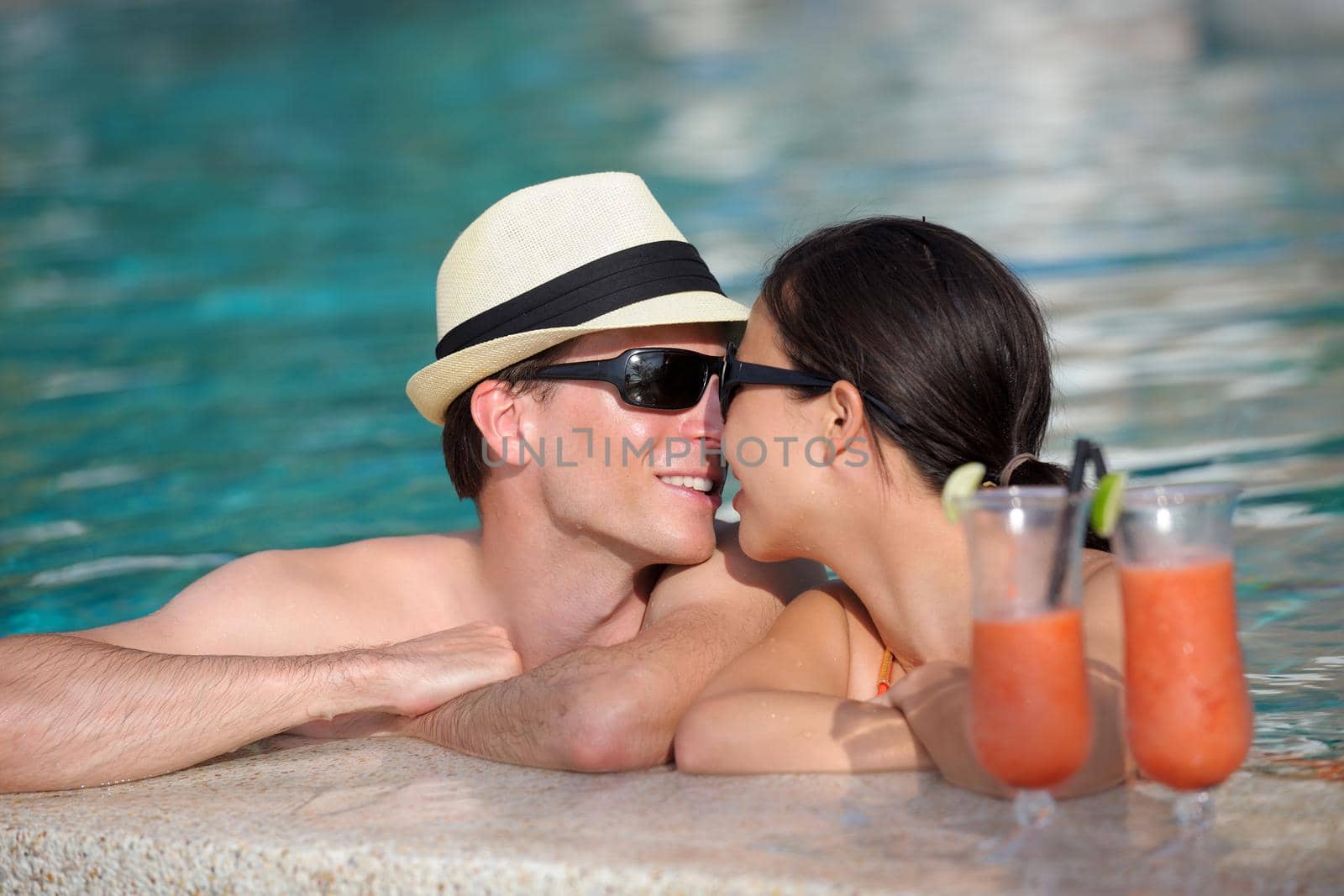 happy young couple relax and take fresh drink at summer vacation