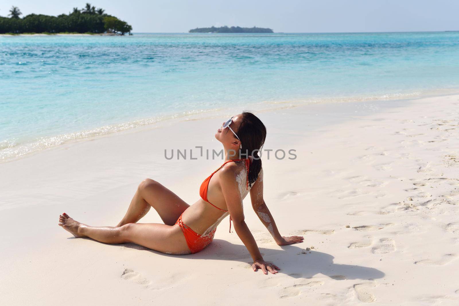 beautiful and happy woman girl on beach have fun and relax on summer vacation  over the sea