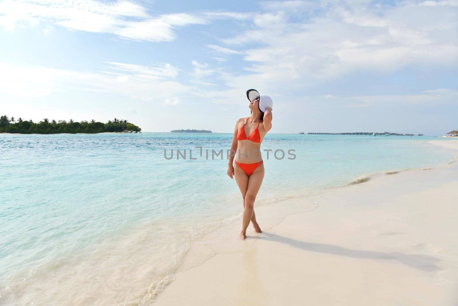 beautiful and happy woman girl on beach have fun and relax on summer vacation  over the sea