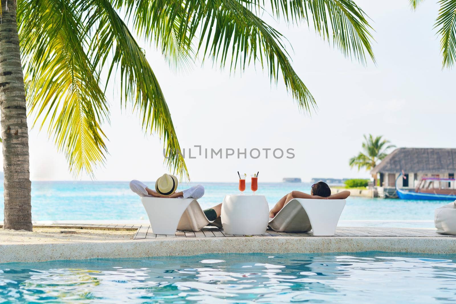 happy young couple have fun on beach by dotshock