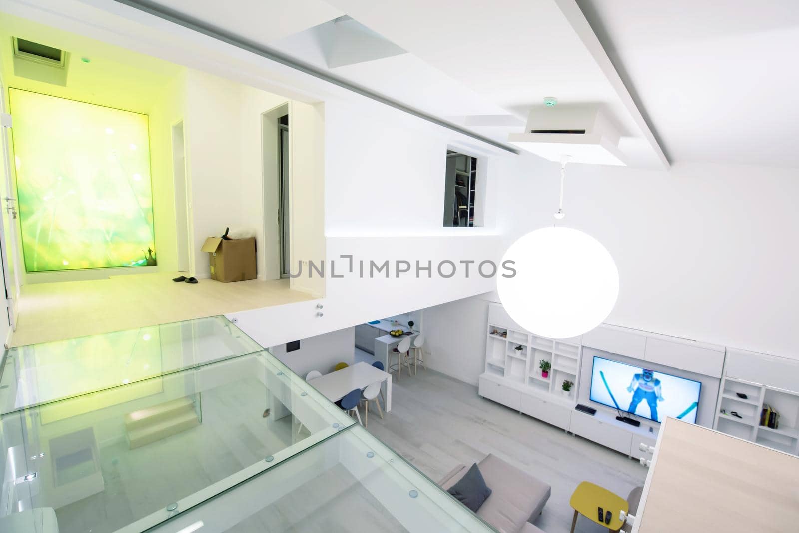 interior of a luxury stylish modern open space design two level apartment with white walls