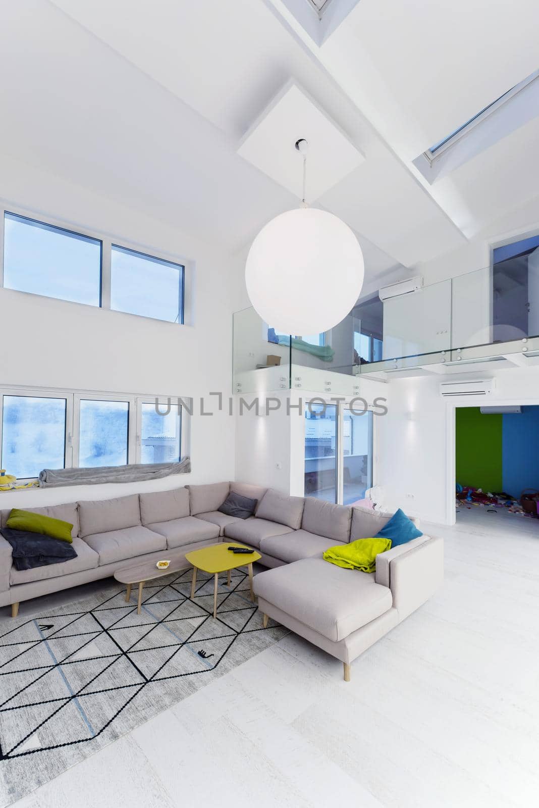 interior of a luxury stylish modern open space design two level apartment with white walls