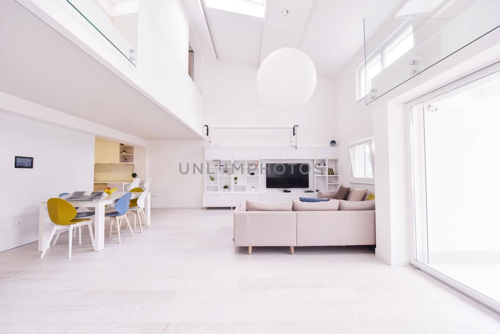 interior of a luxury stylish modern open space design two level apartment with white walls