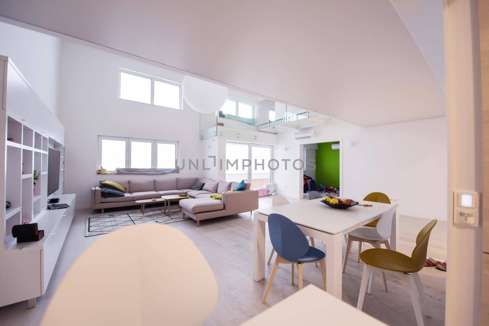 interior of a luxury stylish modern open space design two level apartment with white walls
