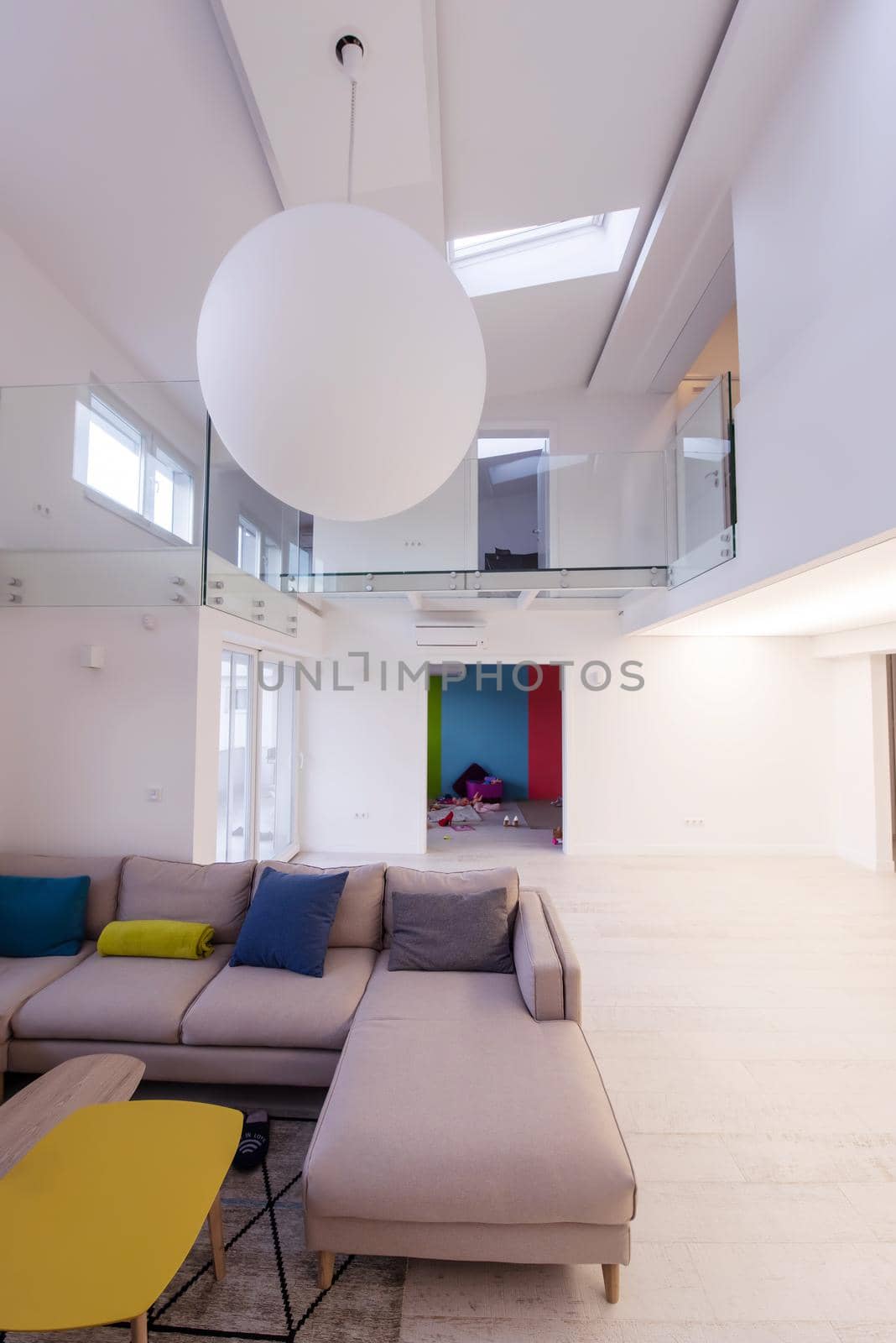 interior of a luxury stylish modern open space design two level apartment with white walls