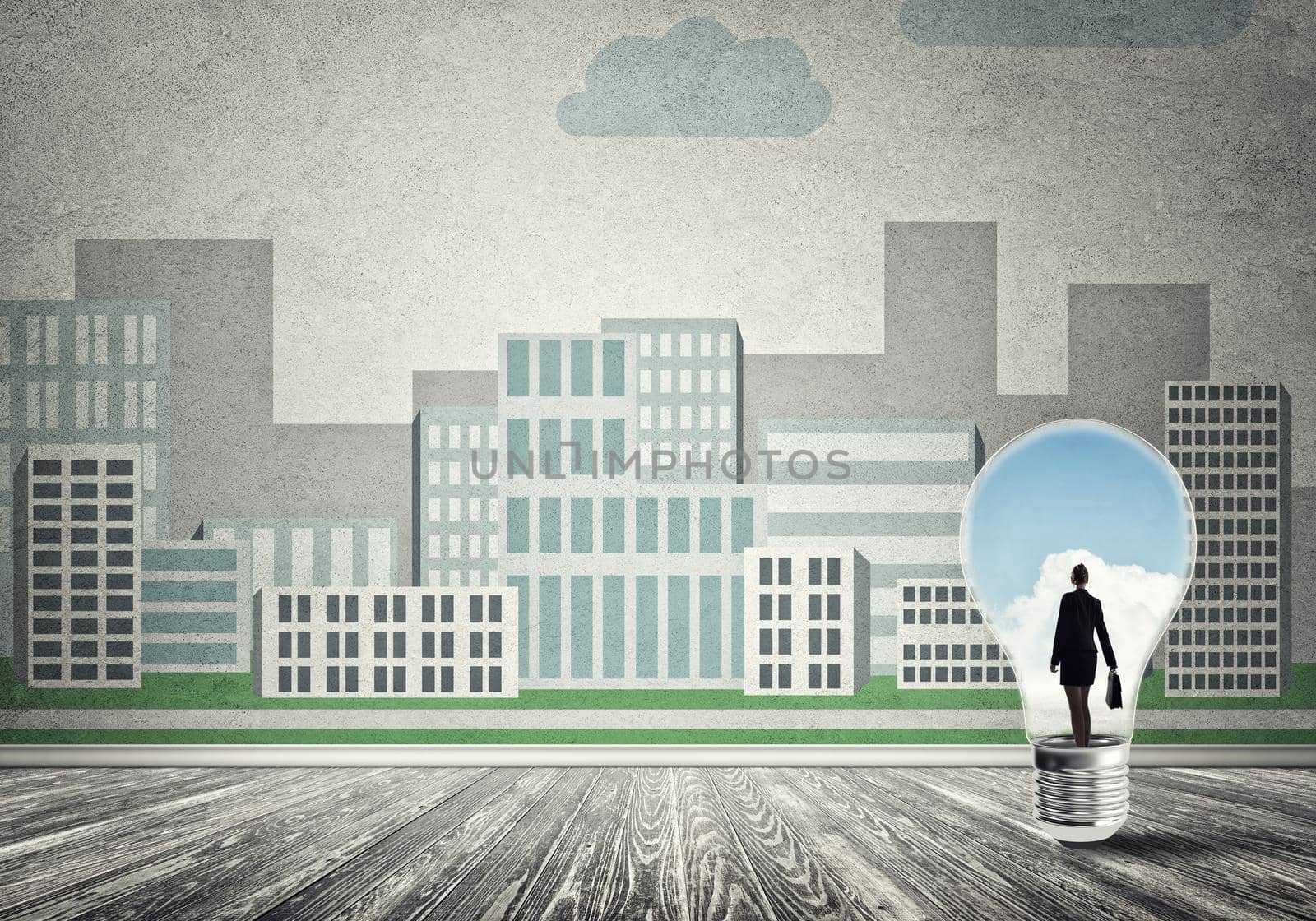Businesswoman inside light bulb against city drawn concept