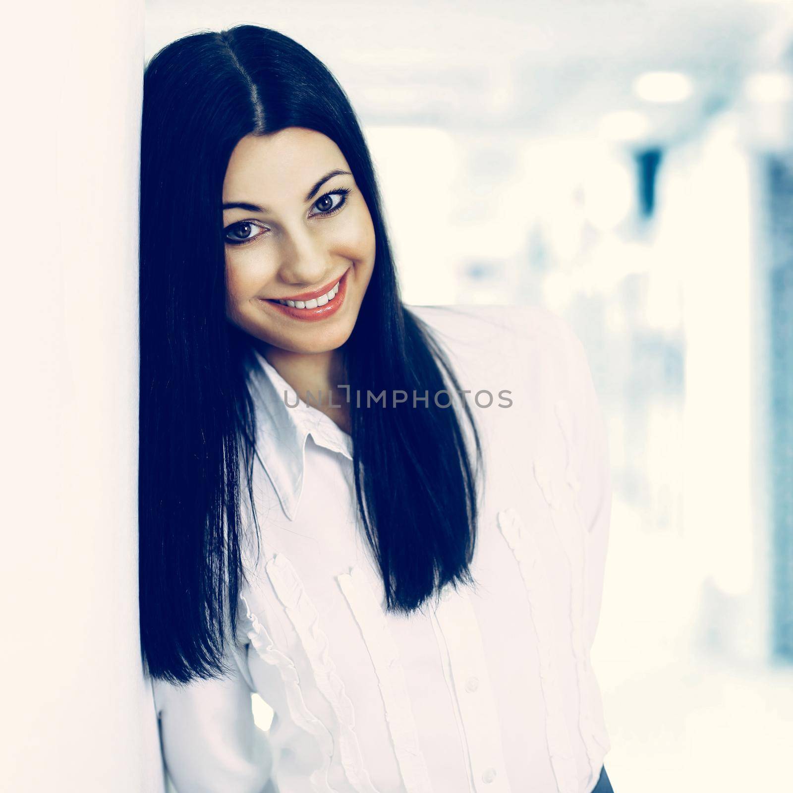 Portrait of a successful business woman on the background brigh by SmartPhotoLab