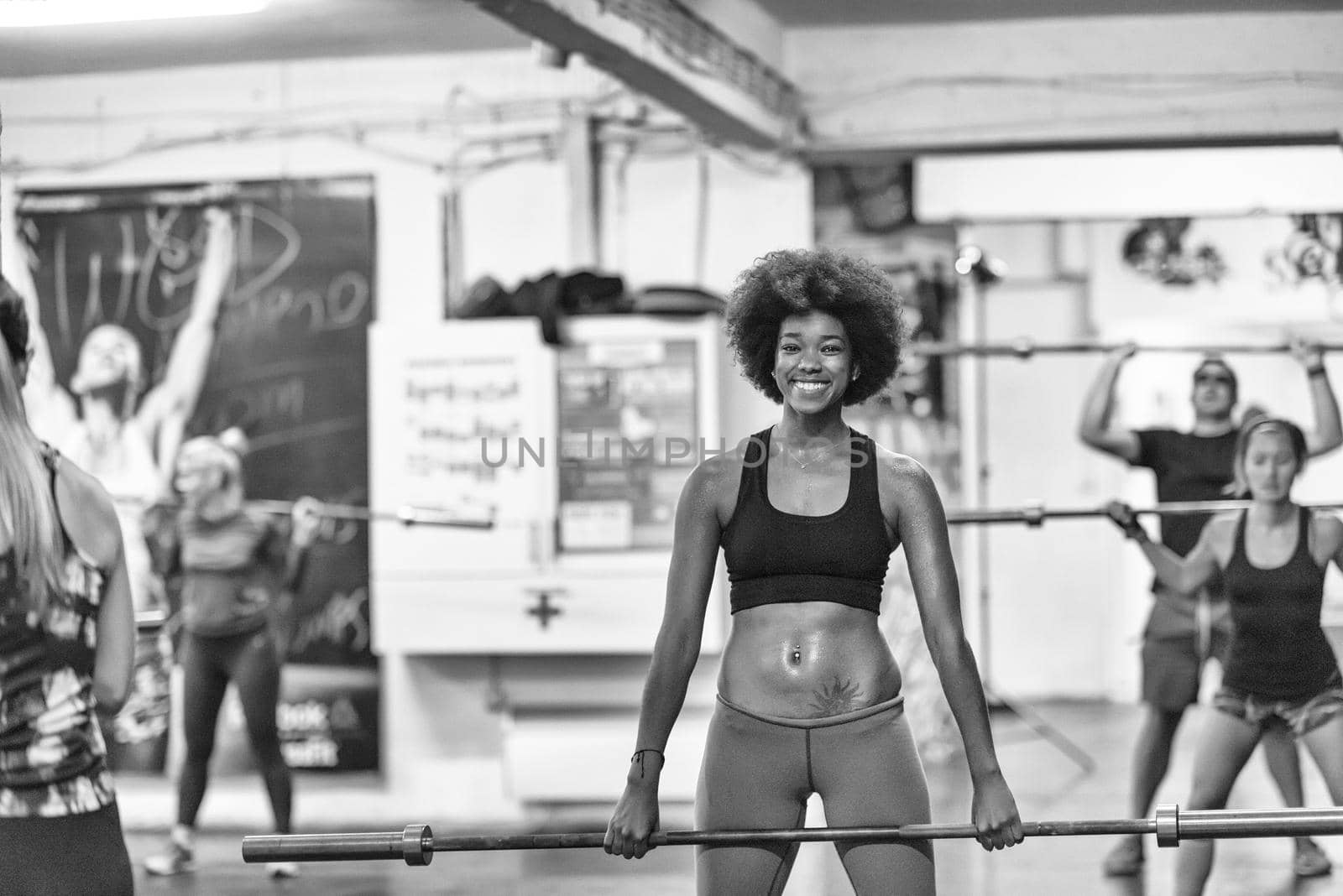 black woman lifting empty bar by dotshock