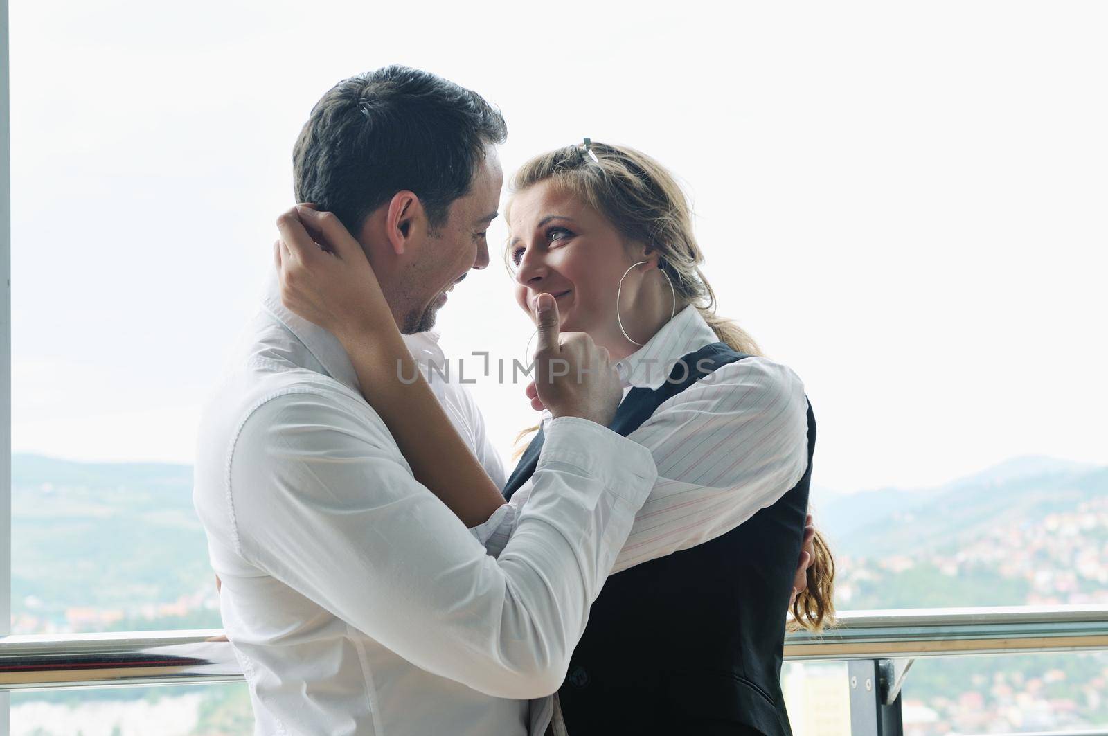 romantic happpy couple on balcony by dotshock