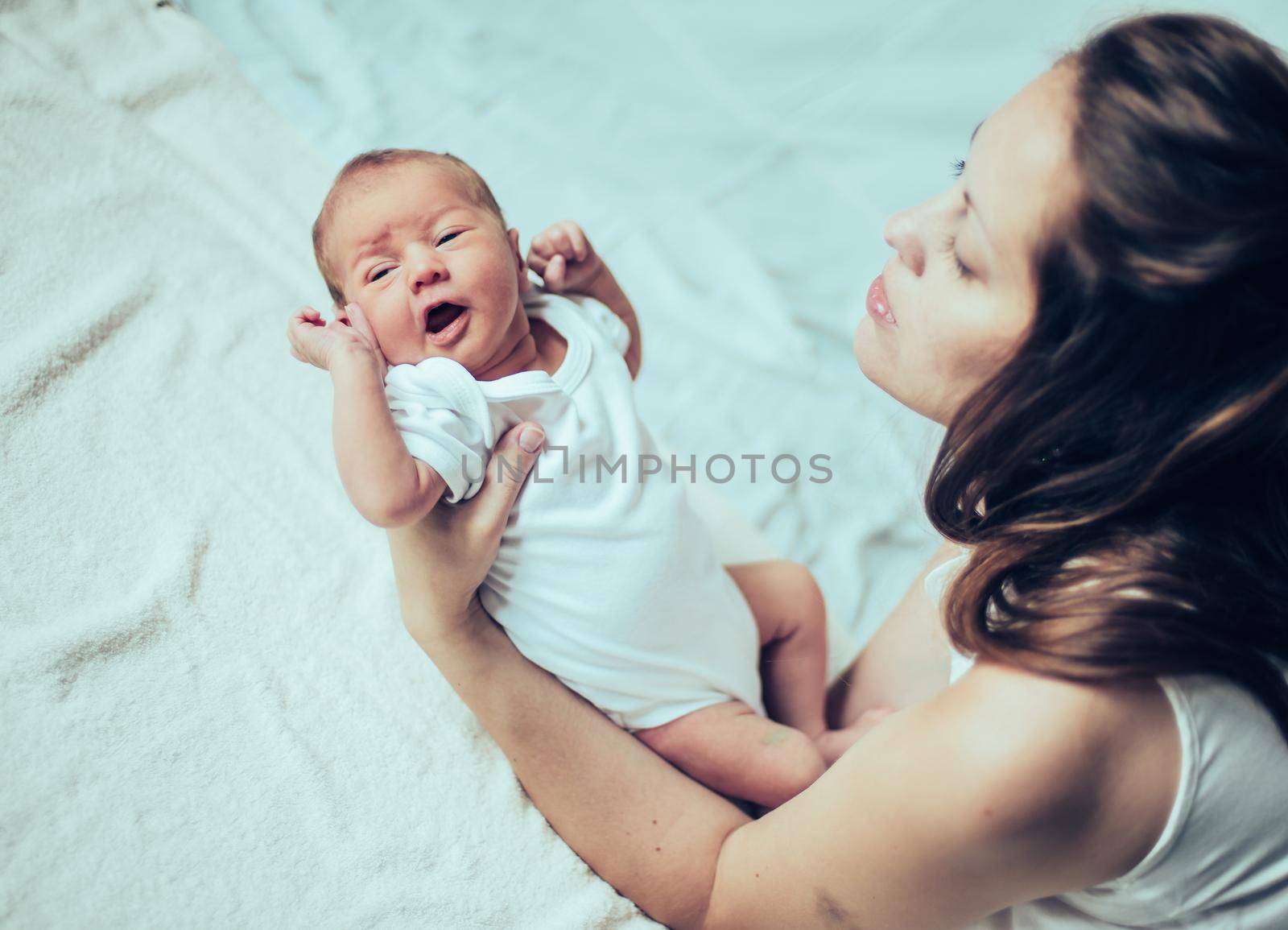 mother with her newborn baby .the photo has a empty space for your text