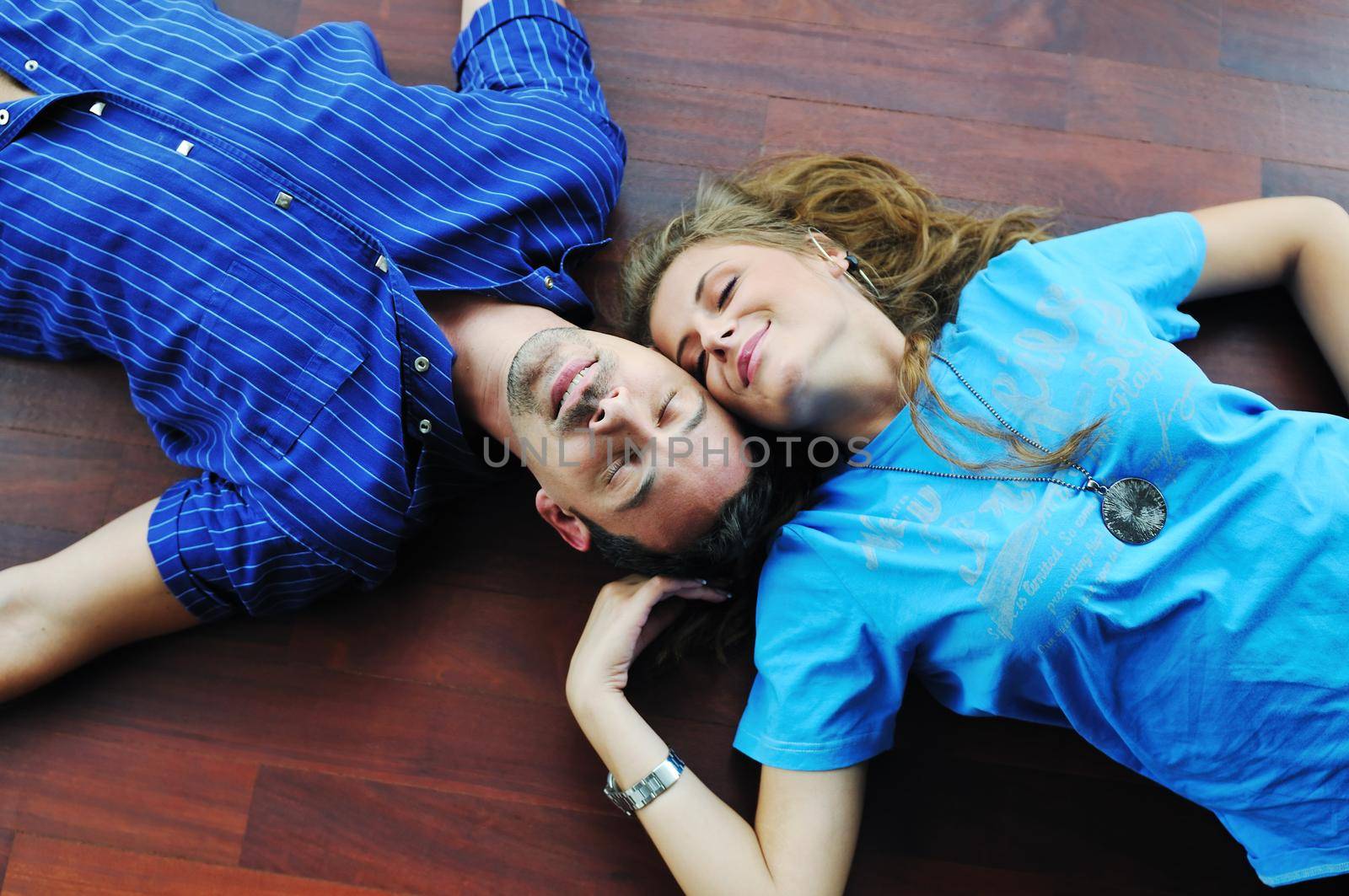 happy couple in empty apartment by dotshock