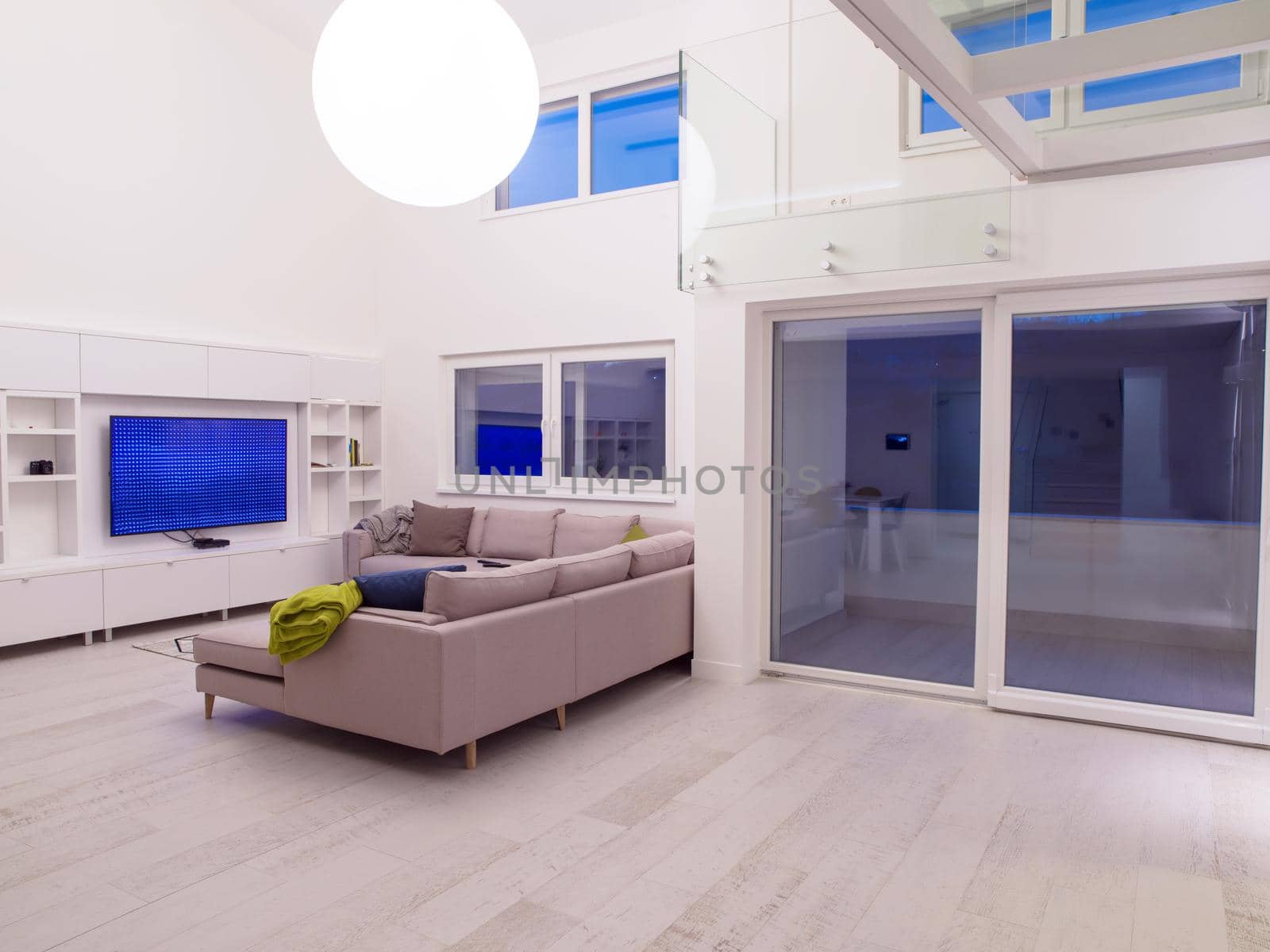 interior of a luxury stylish modern open space design two level apartment with white walls