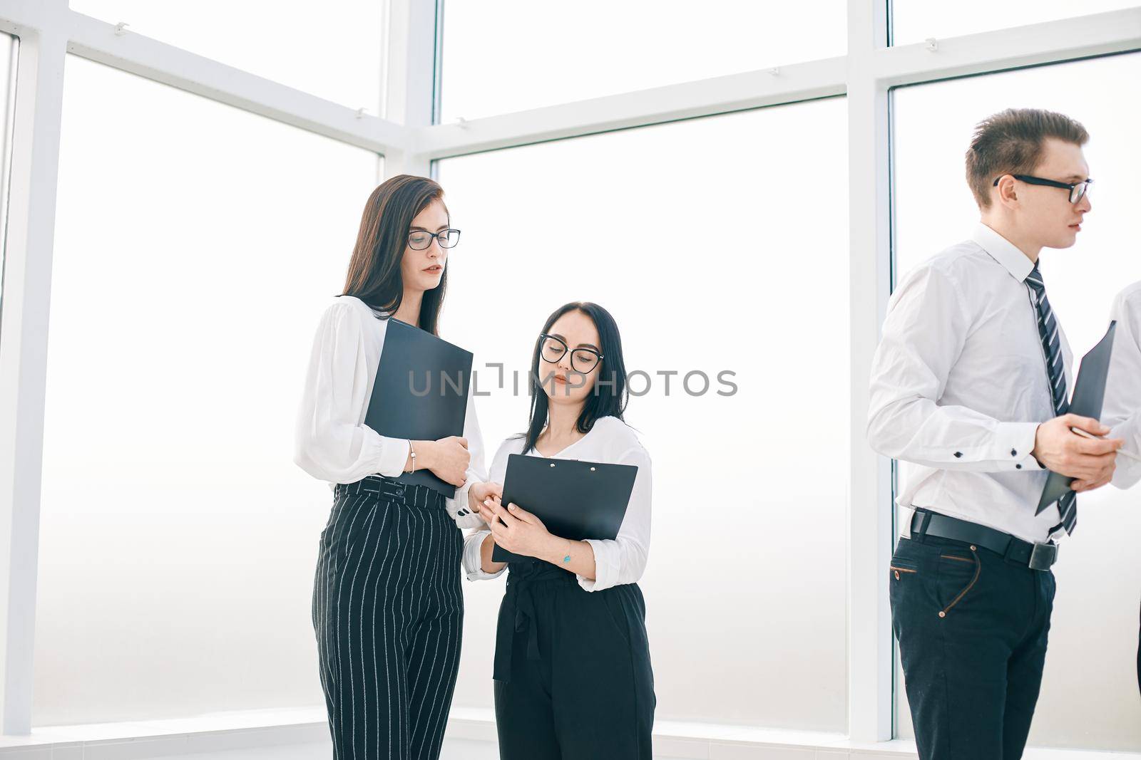 employees discussing the work plan before starting a business seminar. business concept