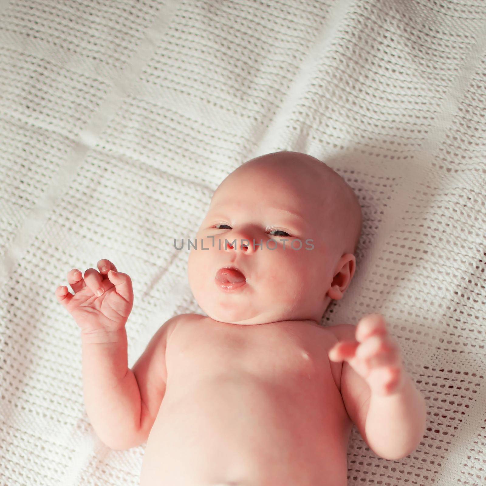 close up. a pretty newborn baby lying on a towel. photo with copy space