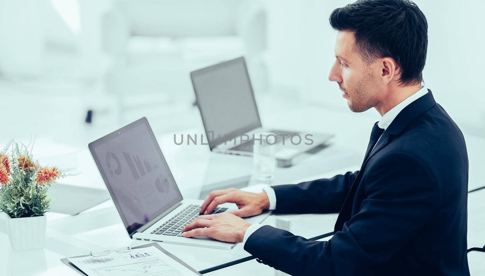 accountant works with financial documents at workplace in office by SmartPhotoLab