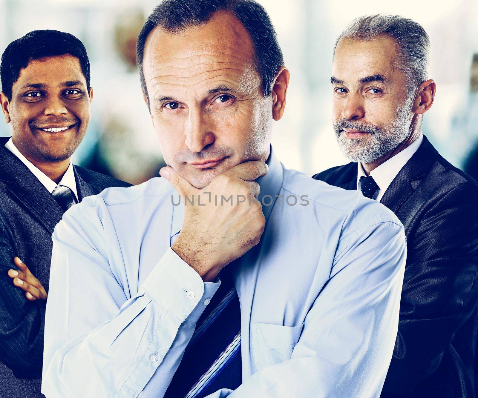 Concept of teamwork and partnership with a group businessman in by SmartPhotoLab