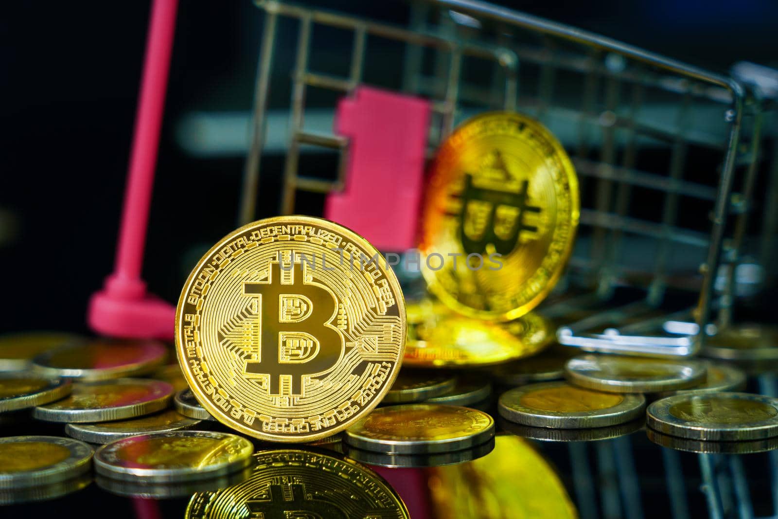 Bitcoin coin in shopping cart on black background by stoonn
