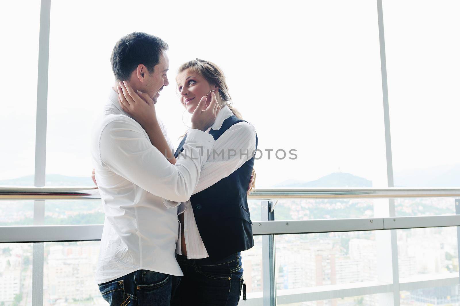romantic happpy couple on balcony by dotshock