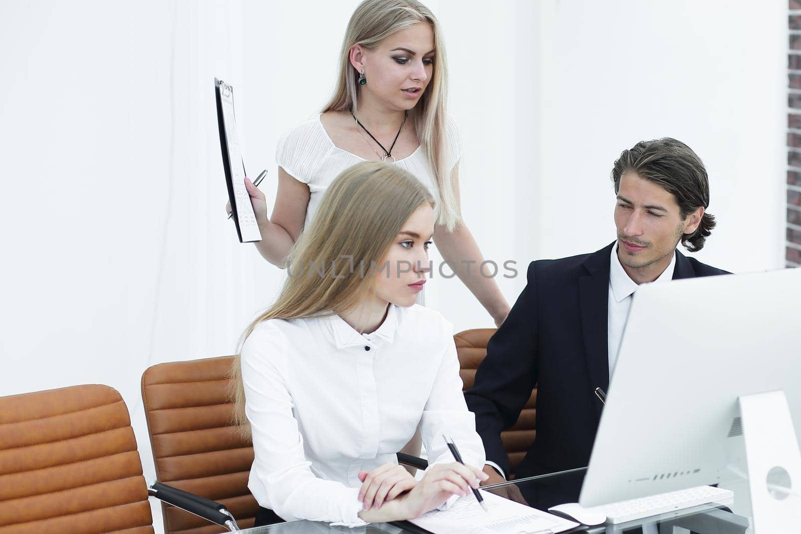 closeup.business team working with documents in a modern office.photo with copy space