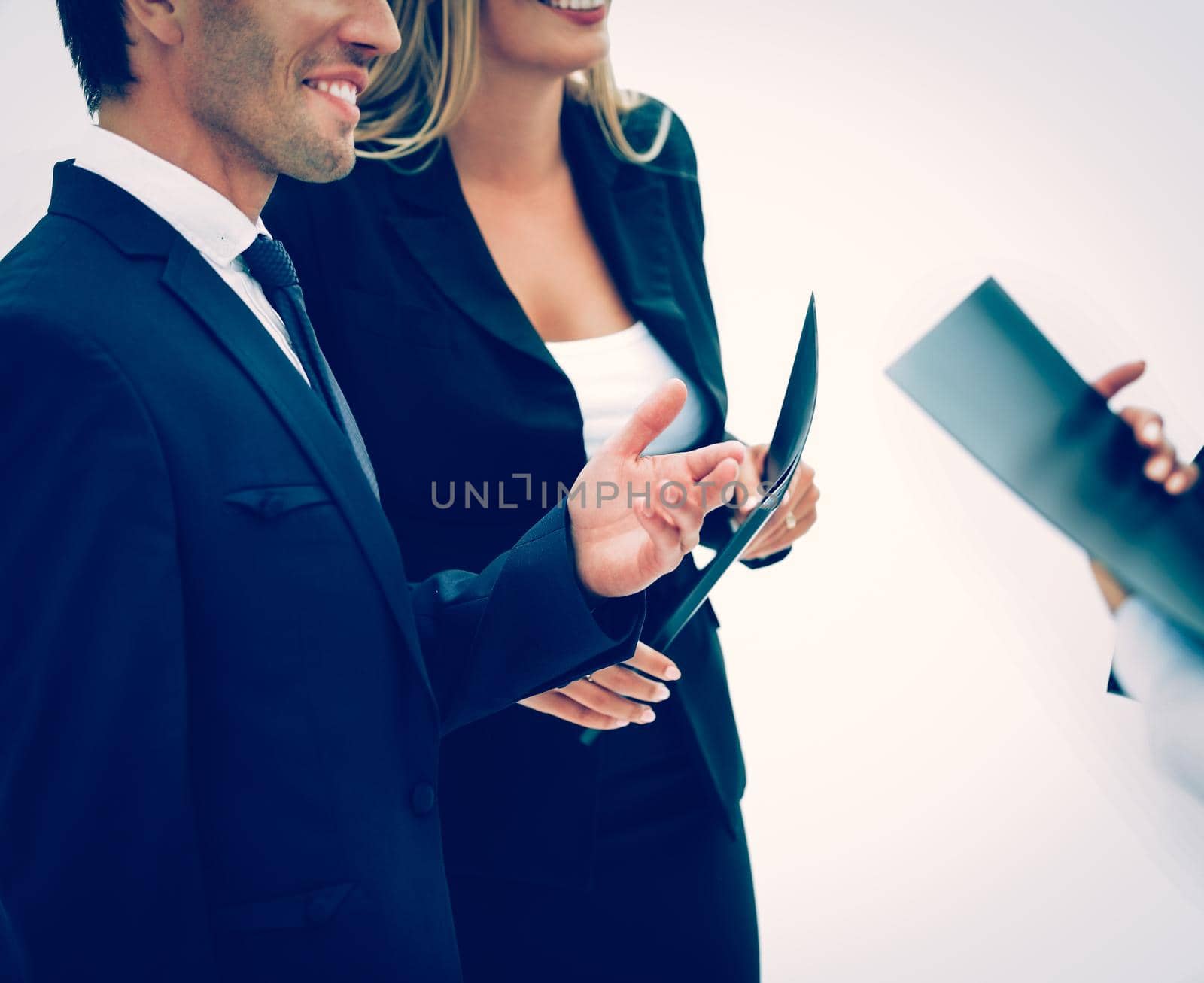 closeup of business partners with working papers before the conference to discuss important points of the speech