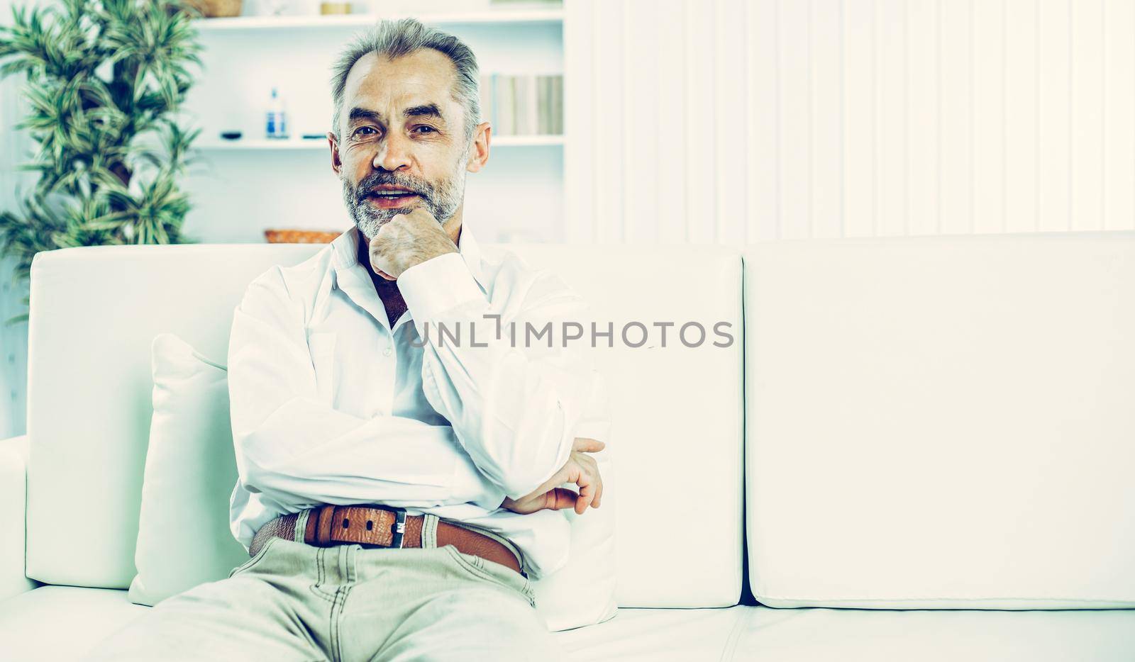 businessman on background of office. the photo has a empty space for your text