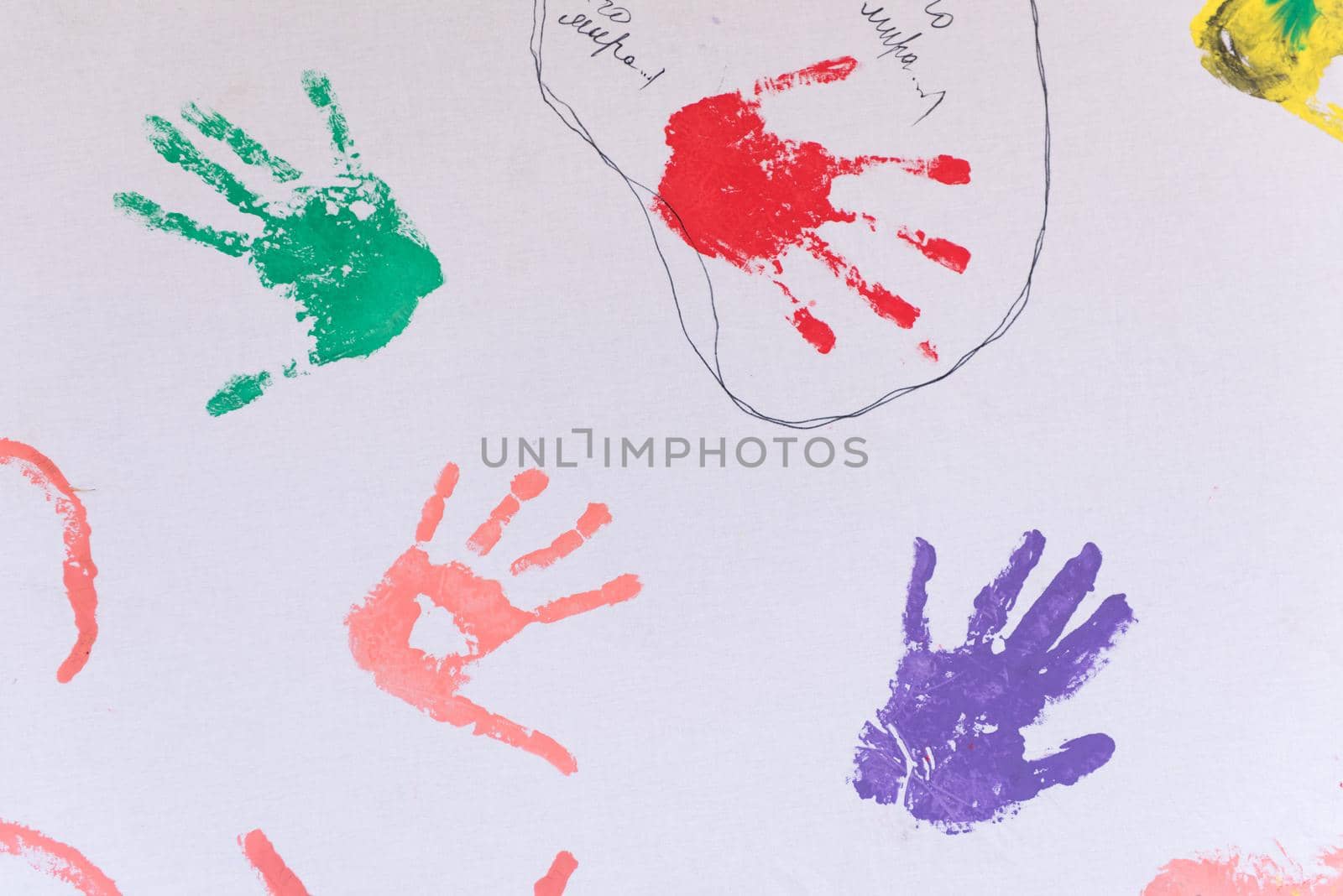 child colorful hand prints on white background