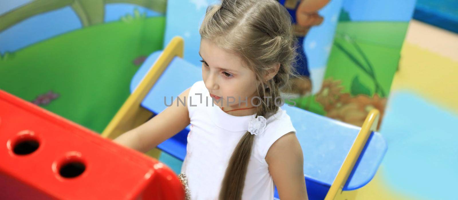 closeup.happy little girl in a soft play centre.