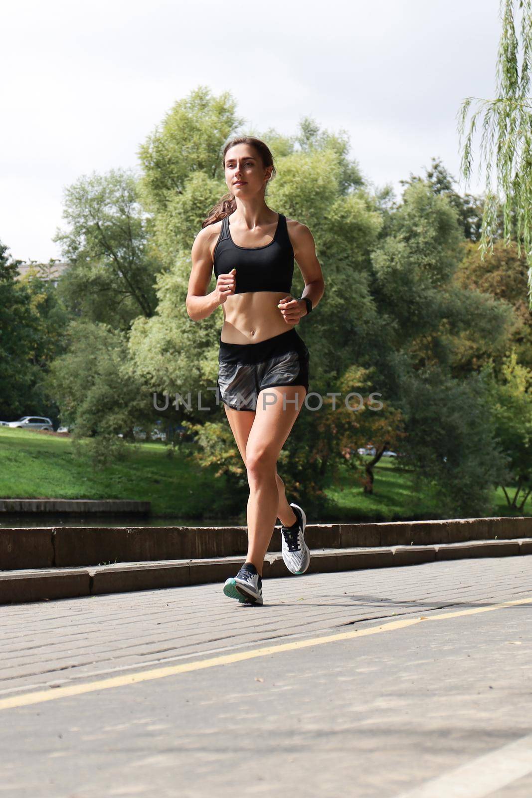 Young sport woman jogging in the park
