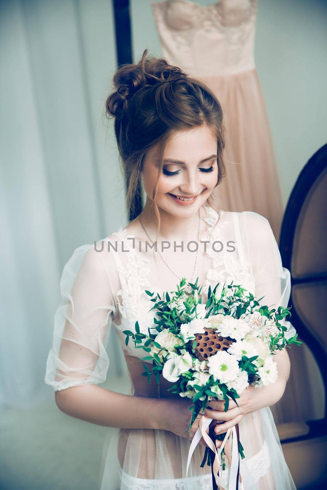 portrait of a pretty young bride with a wedding bouquet. holidays and events