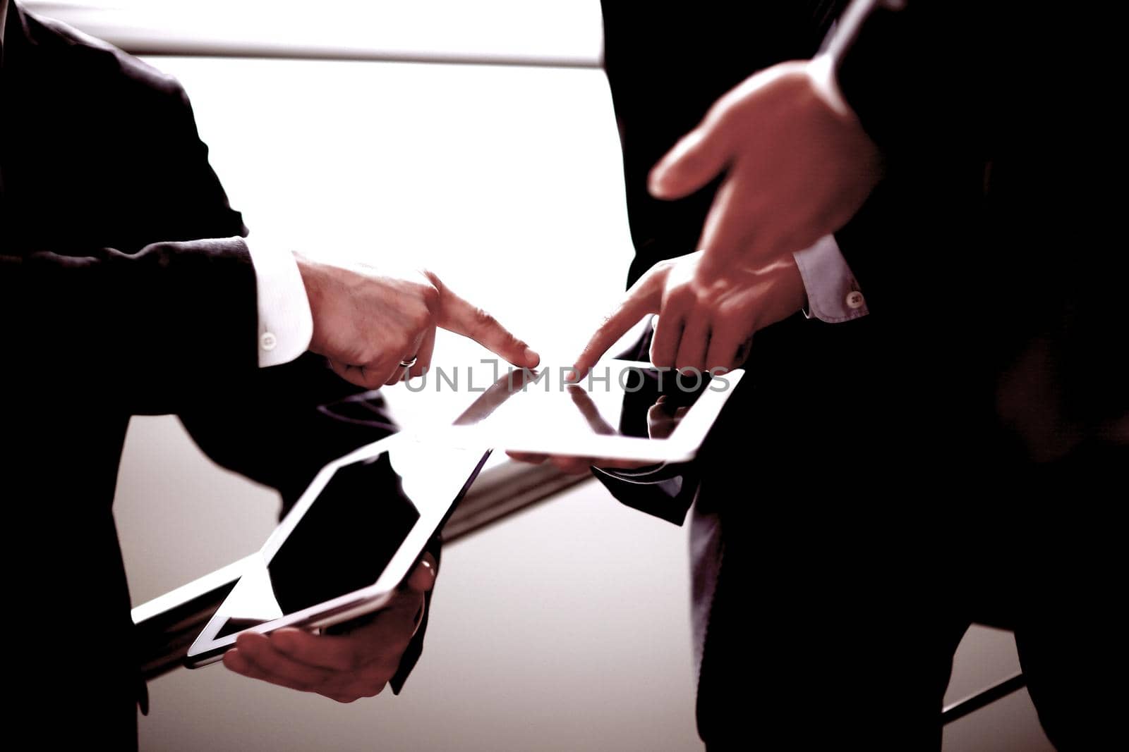 Hands of people working with tablet computer. Technology.