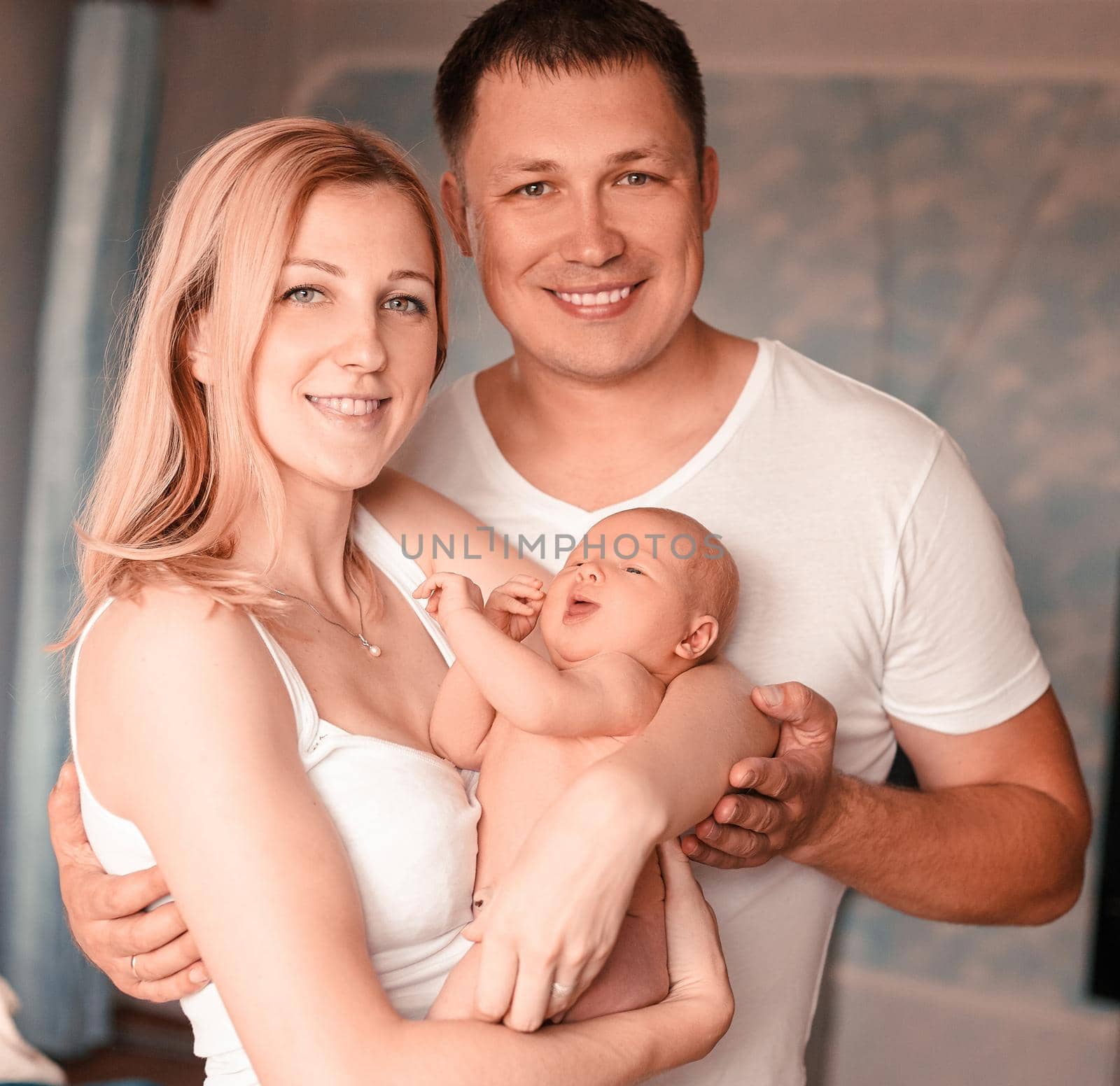 close up. happy family with a newborn baby . the concept of family happiness
